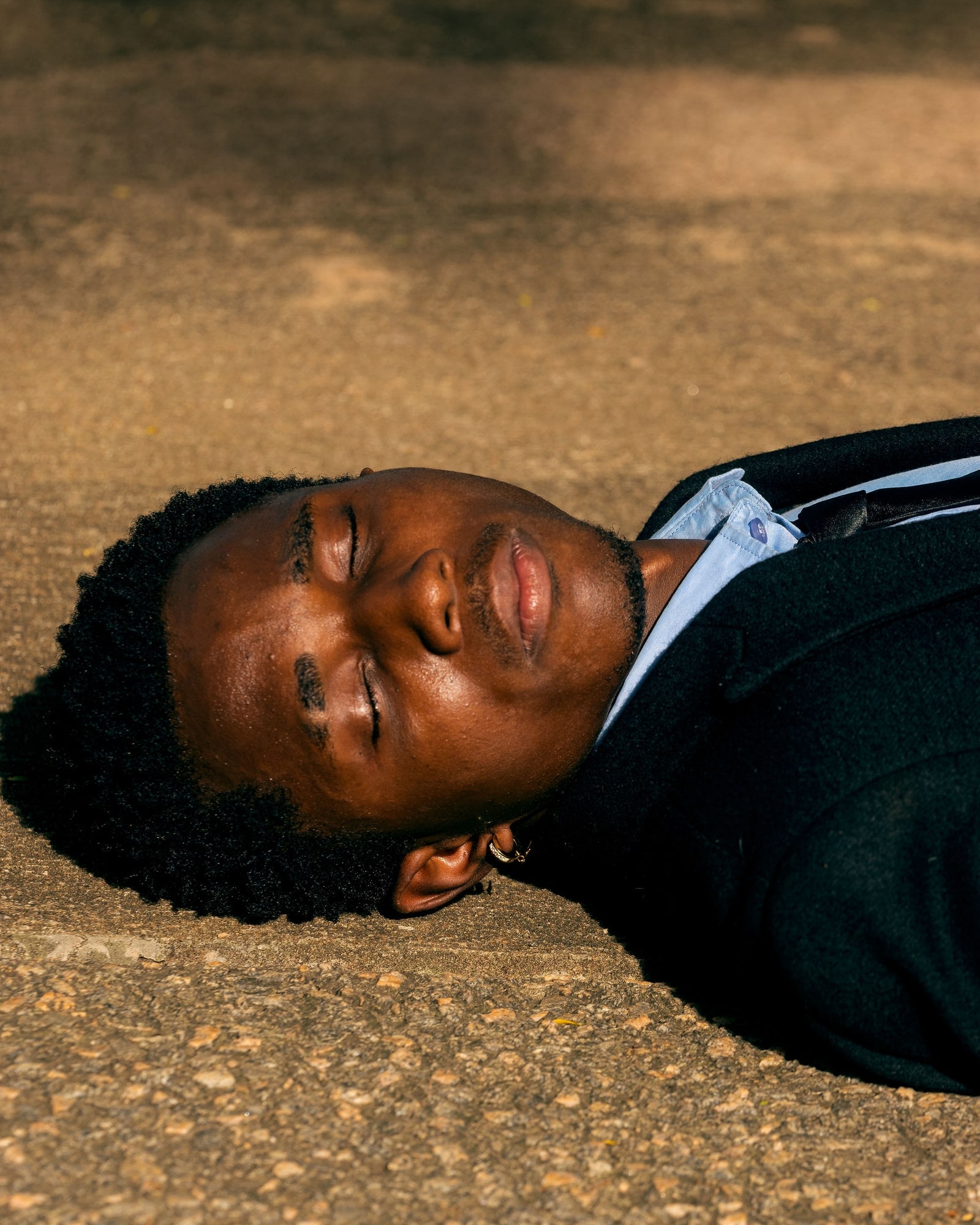 An exhausted professional lying on the ground